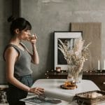 Woman enjoying tea at home as part of a calm health after 40 routine