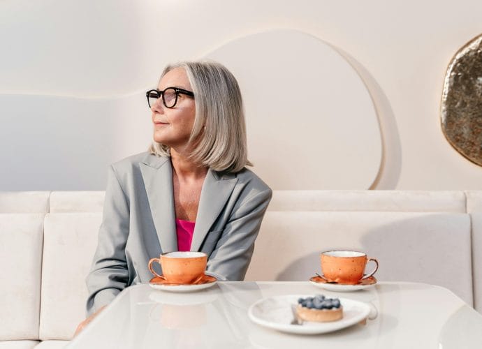 Emotional tensions in the family reflected in a woman sitting alone at a table