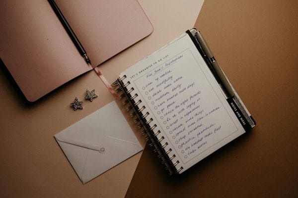 Woman journaling her goals in the morning – building accountability to take responsibility and change your life