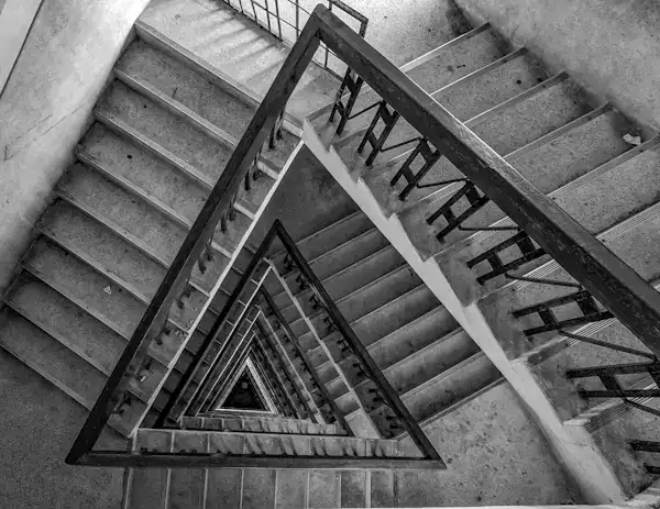 Spiral staircase viewed from above, symbolizing building life transformation one habit at a time