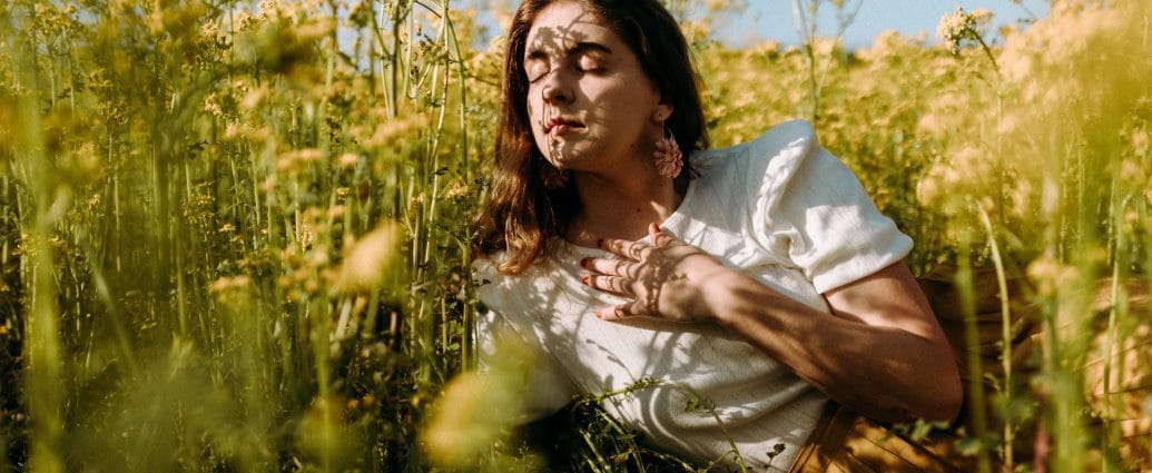 Woman reflecting on whether she feels intuition, fear, or a trauma response