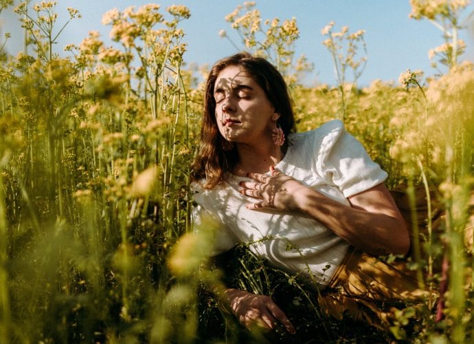 Woman reflecting on whether she feels intuition, fear, or a trauma response
