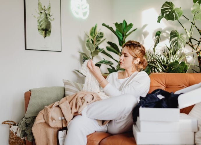 Woman decluttering her home by organizing everyday items using simple practical routines