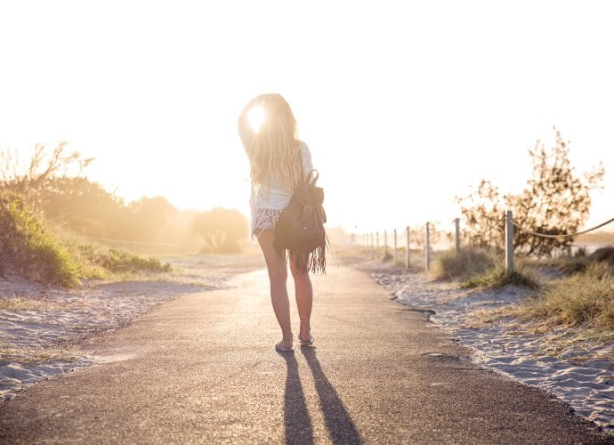 Woman moving forward and realizing her life is not behind